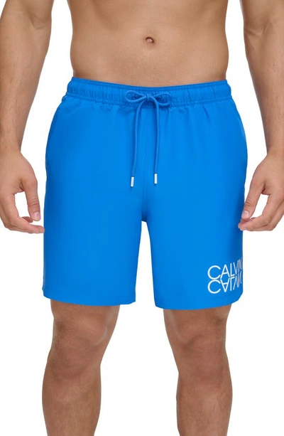 Calvin Klein Men's Reflection Logo Elastic Waist 7" Volley Swim Trunks In Blue