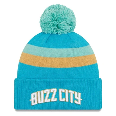 New Era Turquoise Charlotte Hornets 2023/24 City Edition Cuffed Pom Knit Hat