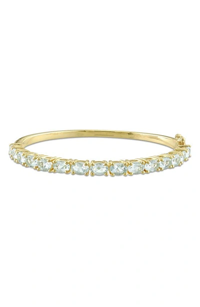 Delmar Gold-tone Oval Aquamarine Bangle Bracelet In Yellow