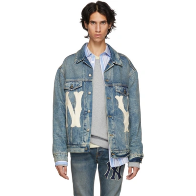 Shop the Men's jacket with NY Yankees™ patch by Gucci. A blue