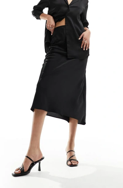 Asos Design Bias Cut Satin Midi Skirt In Black
