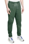 Nike Woven Tapered Leg Pants In Green