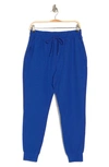 Beyond Yoga Spacedye Commuter Midi Joggers In Electric Royal Heath