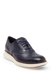 Cole Haan 2.zerogrand Wingtip Oxford In Navy Leather/ivory