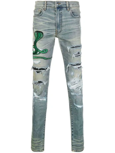 Amiri Thrasher Skinny-fit Appliquéd Distressed Stretch-denim Jeans In Blue