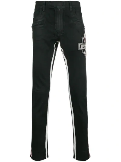 Balmain Embellished Logo Jeans In Black