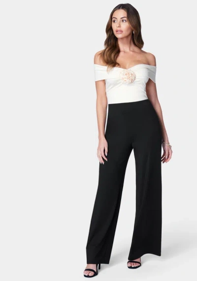 Bebe Off Shoulder Rosette Jumpsuit In Black,ivory