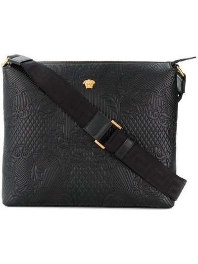 Versace Embossed Messenger Bag In Black