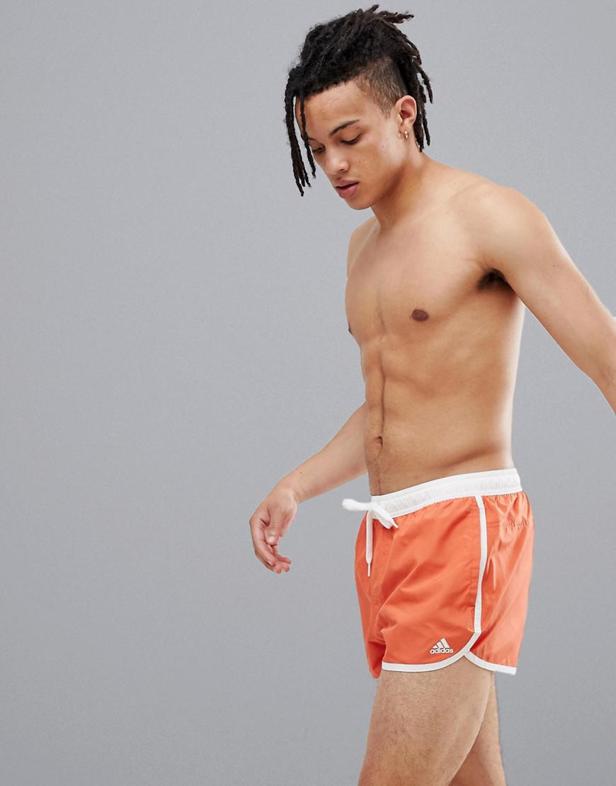 orange adidas swim shorts