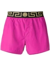 Versace Logo Band Swim Shorts In Pink