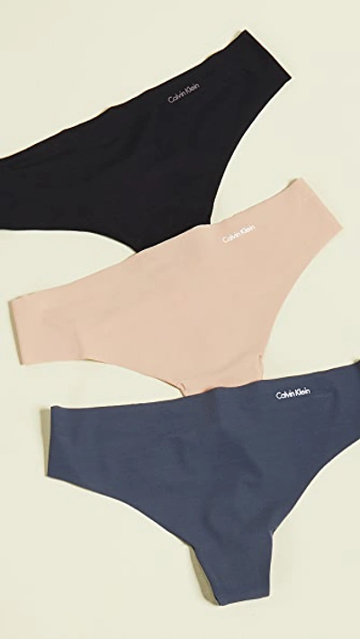 Calvin Klein Underwear Invisibles Thong 3 Pack In Speakeasy/light Caramel/black