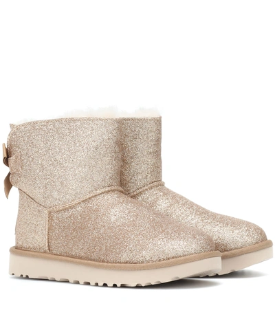 Ugg Mini Bailey Bow Glitter Ankle Boots In Gold | ModeSens