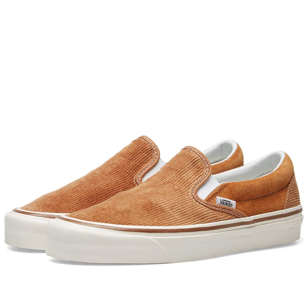 tan fuzzy slip on vans