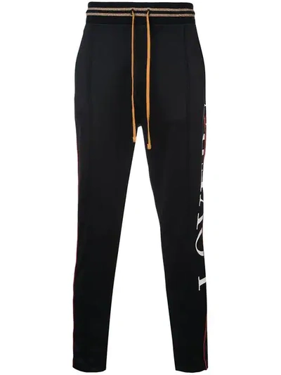 Amiri Striped Trim Track Pants In Black