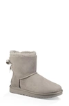 Ugg Mini Bailey Bow Ii Genuine Shearling Bootie In Seal Suede