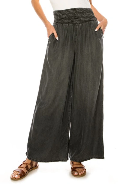 A Collective Story Smocked Waist Palazzo Trousers In Black