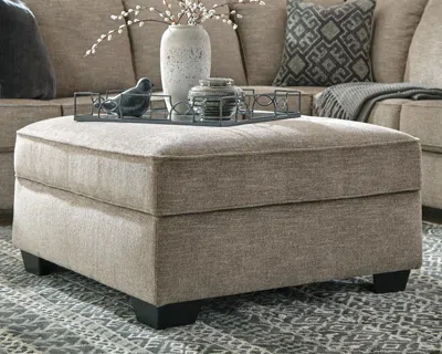 Ashley Bovarian Ottoman In Stone