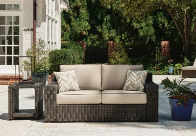 Ashley Coastline Bay Outdoor Loveseat With Cushion In Brown