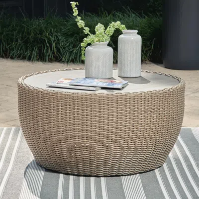 Ashley Danson Outdoor Coffee Table In Beige
