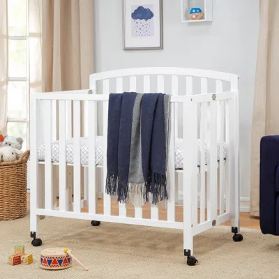 Ashley Davinci Dylan Folding Portable 3-in-1 Mini Crib And Twin Bed In White