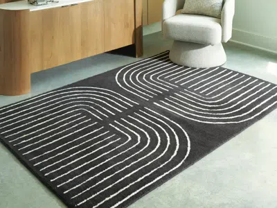 Ashley Eldonmore 5' X 7' Area Rug In Black/ivory