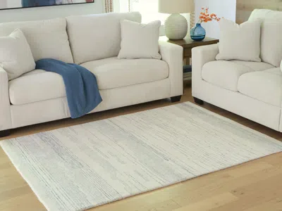 Ashley Genemost 5' X 7' Area Rug In Ivory/blue