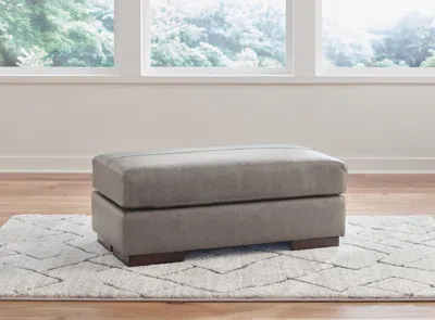 Ashley Lombardia Leather Ottoman Leather In Fossil