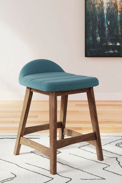 Ashley Lyncott Counter Height Upholstered Bar Stool In Blue/brown