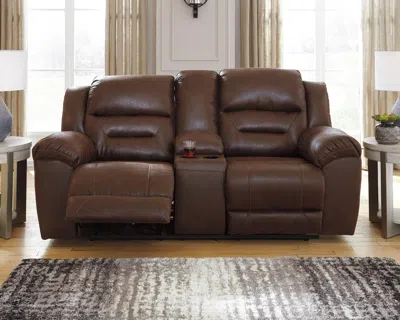 Ashley Stoneland Manual Reclining Loveseat With Console In Chocolate