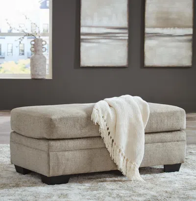 Ashley Stonemeade Ottoman In Taupe