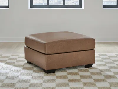 Ashley Whitlock Oversized Accent Ottoman In Caramel