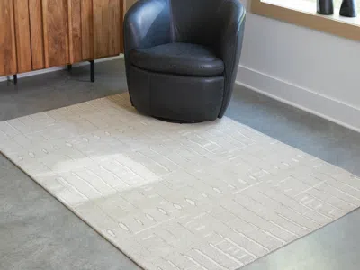 Ashley Wolbert 5' X 7' Area Rug In Tan/ivory