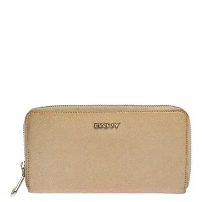 Dkny Metallic Beige Leather Zip Around Wallet In Pink