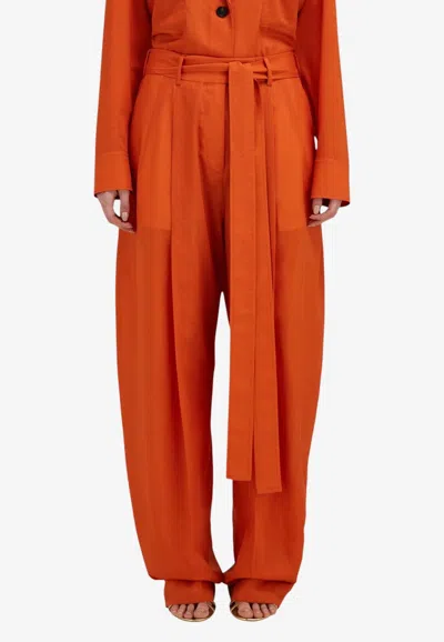 Ferragamo Belted Barrel-leg Wool Pants In Orange