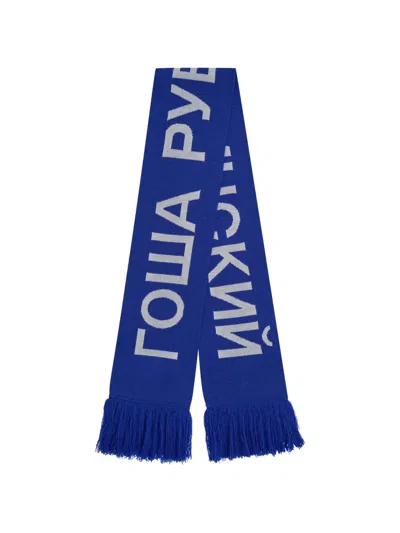 Gosha Rubchinskiy Logo-knit Fringed Scarf In Blue