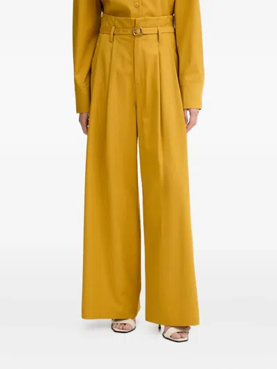 Isabelle Blanche Belted Pleated Palazzo Pants In Yellow