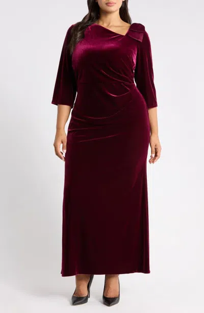 Jessica Howard Asymmetrical Neck Bow Velvet Gown In Burgundy