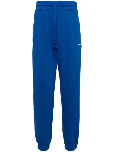 Les Benjamins Logo-print Cotton Track Pants In Blau