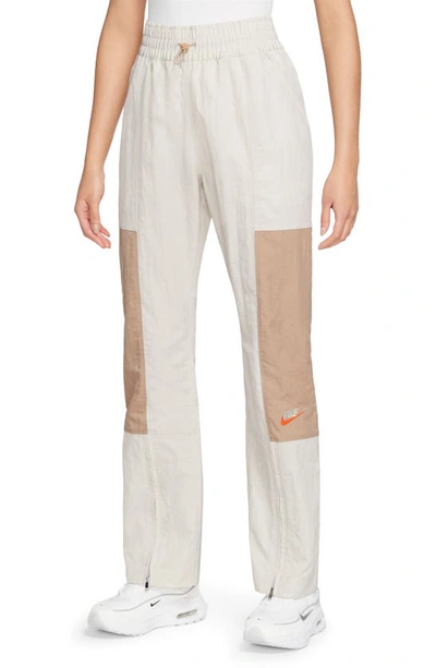 Nike City Utility Zip Cuff Track Trousers In Light Orewood Brown/ Hemp