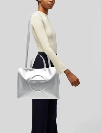 Pre-owned Telfar Vegan Leather Tote In Metallic/silver