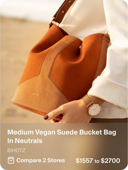 Product card showing a tan vegan suede bucket bag by Bhotz, with price range $1557 to $2700 and comparison across 2 stores.