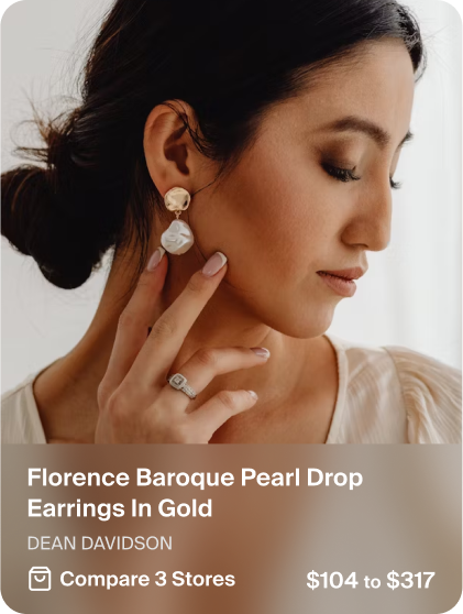 Product card of gold pearl drop earrings by Dean Davidson, worn by a model, with price range $104 to $317 across 3 stores.
