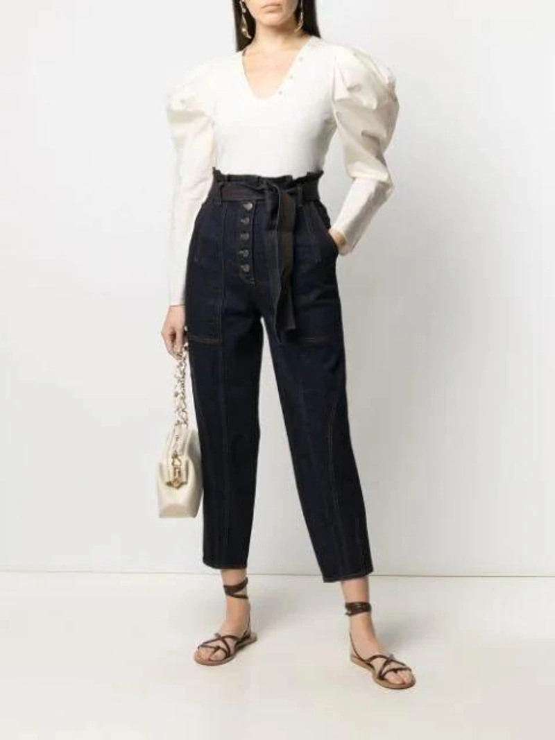 Farfetch's Post | Wearing: Ulla Johnson Brier Belted-waist Tapered Jeans In Blue; Ulla Johnson U-neck Puff-sleeve Blouse In White