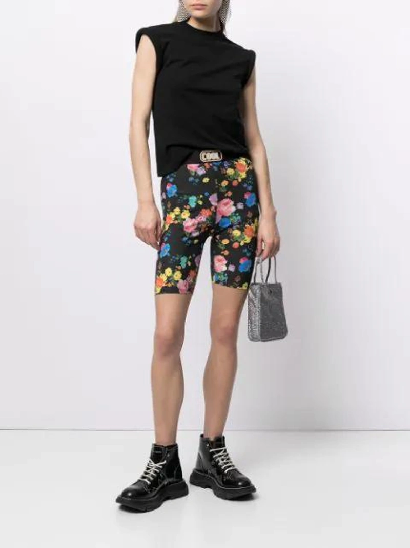 Farfetch's Post | Wearing: Alexander Mcqueen Glossed-leather Exaggerated-sole Ankle Boots In Black; Cool Tm Floral Print Biker Shorts In Multicolour; Rta Kairi Cotton-jersey T-shirt In Black