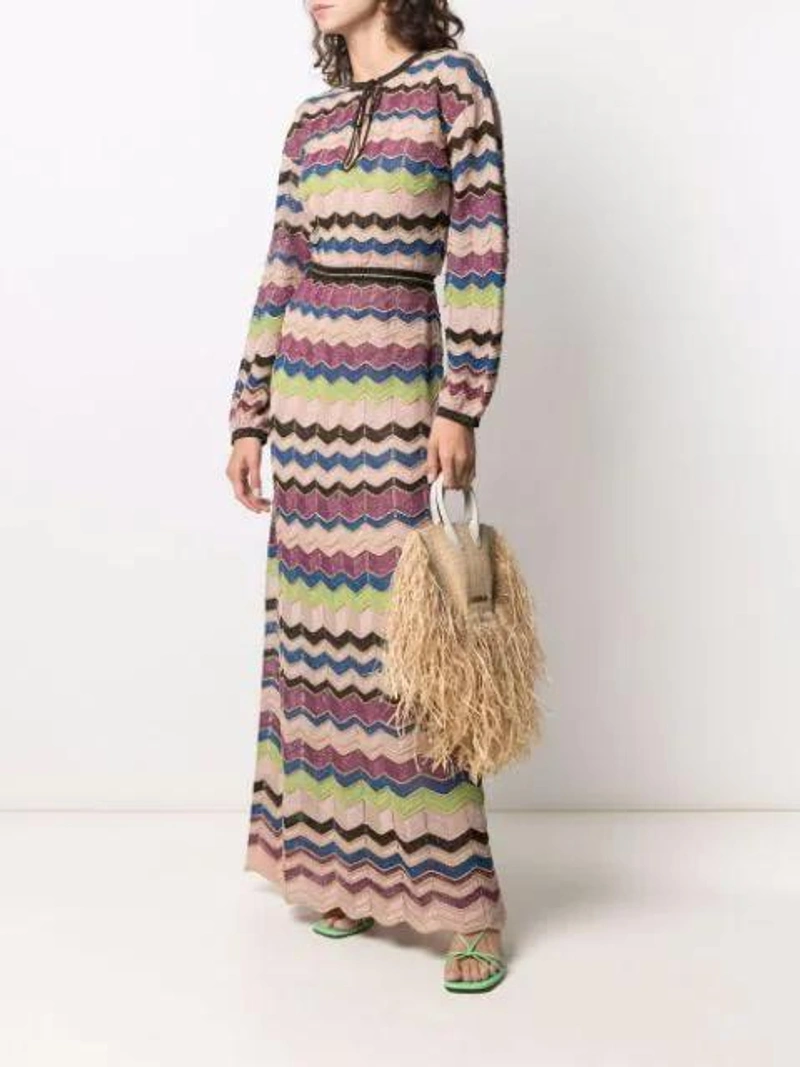 Farfetch's Post | Wearing: Missoni Zigzag-pattern Maxi Dress In Neutrals; Jacquemus Le Petite Baci Small Leather-trimmed Fringed Raffia Tote In Beige Leather; Jil Sander Sphere-embellished Drop Earrings In Gold