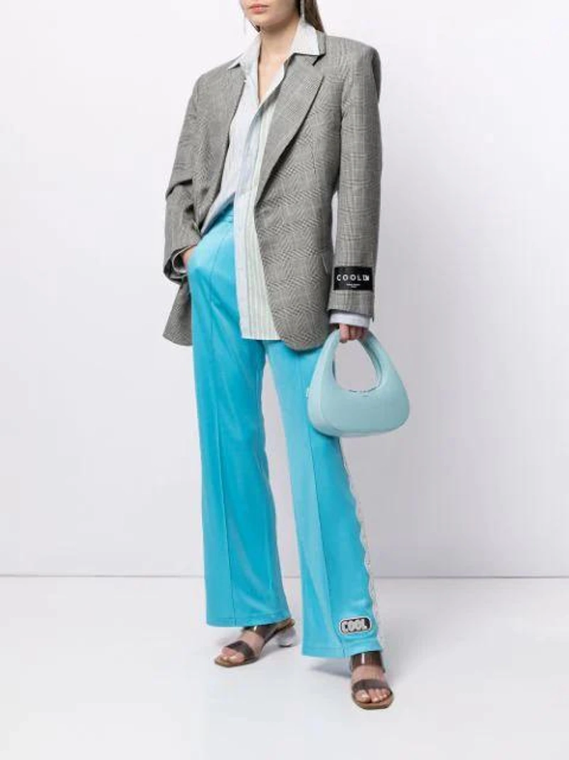Farfetch's Post | Wearing: Cool Tm Check Linen-wool Blend Blazer In Black; Cool Tm Cool T.m Turquoise Lace Sweatpants; Coperni Baguette Leather Top Handle Bag In Blue