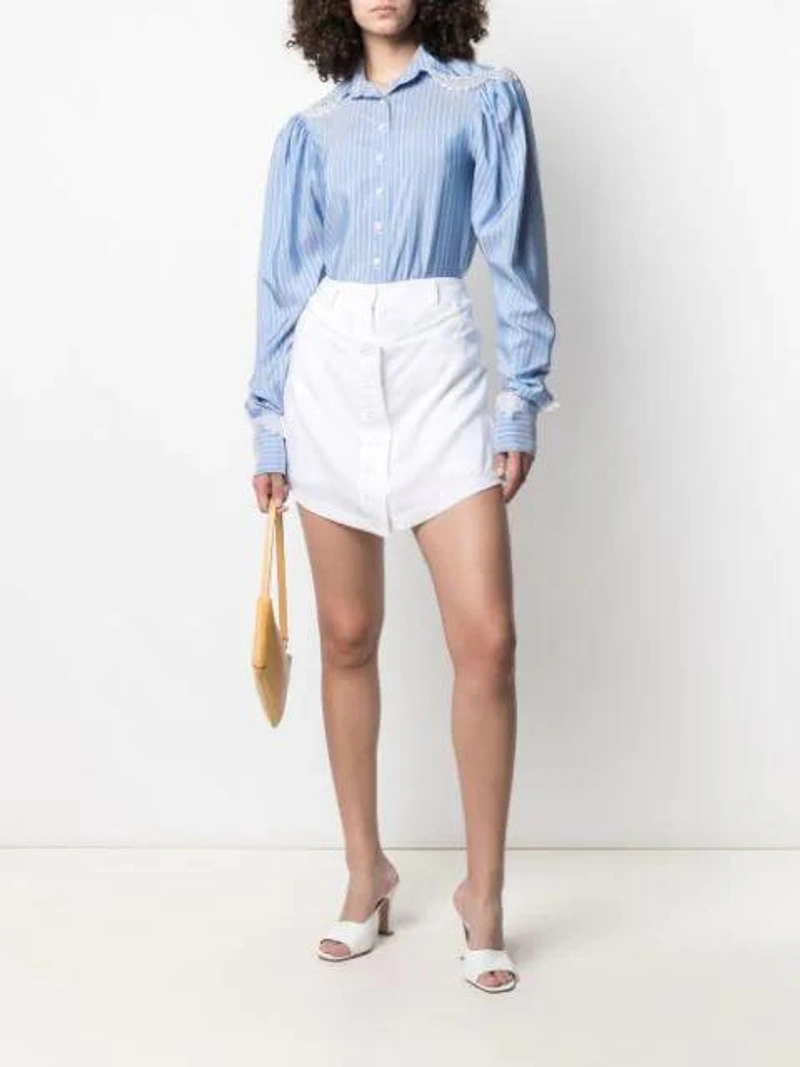 Farfetch's Post | Wearing: Almaz Layered Linen Shorts In White; Almaz Long-sleeve Lace-trim Shirt In Blue; Manu Atelier Pita Baguette Leather Shoulder Bag In Yellow