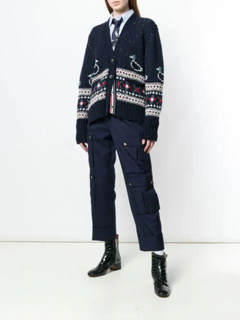 Farfetch's Post | Wearing: Thom Browne Cropped Cargo Trousers In Blue; Thom Browne Duck Fair Isle Oversized Cardigan In Blue; Thom Browne Light Blue Embroidery Point Collar Shirt