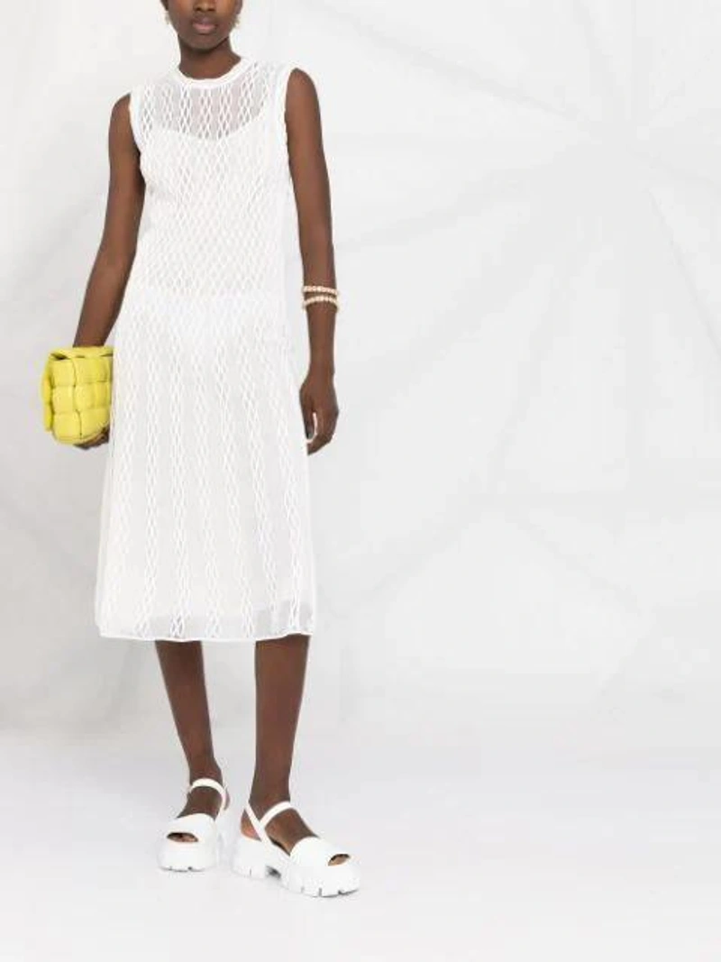 Farfetch's Post | Wearing: Fendi Knitted Midi Dress In White; Dannijo Kaia Drop Earrings In Gold; Jw Anderson Crystal Loop Cuff Bracelet In Gold