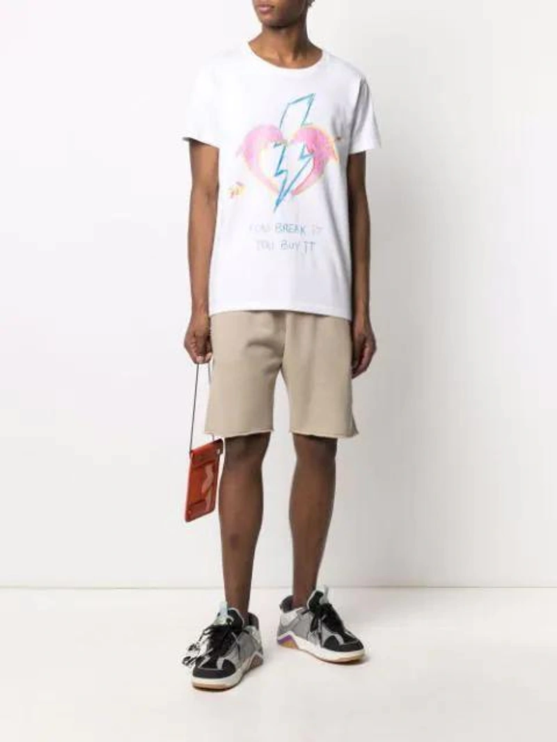 Farfetch's Post | Wearing: Cool Tm Graphic-print Cotton T-shirt In White; Off-white X Browns 50 Caravaggio Track Shorts In Green; Jw Anderson Pulley Clutch Bag In 433 Br Orng